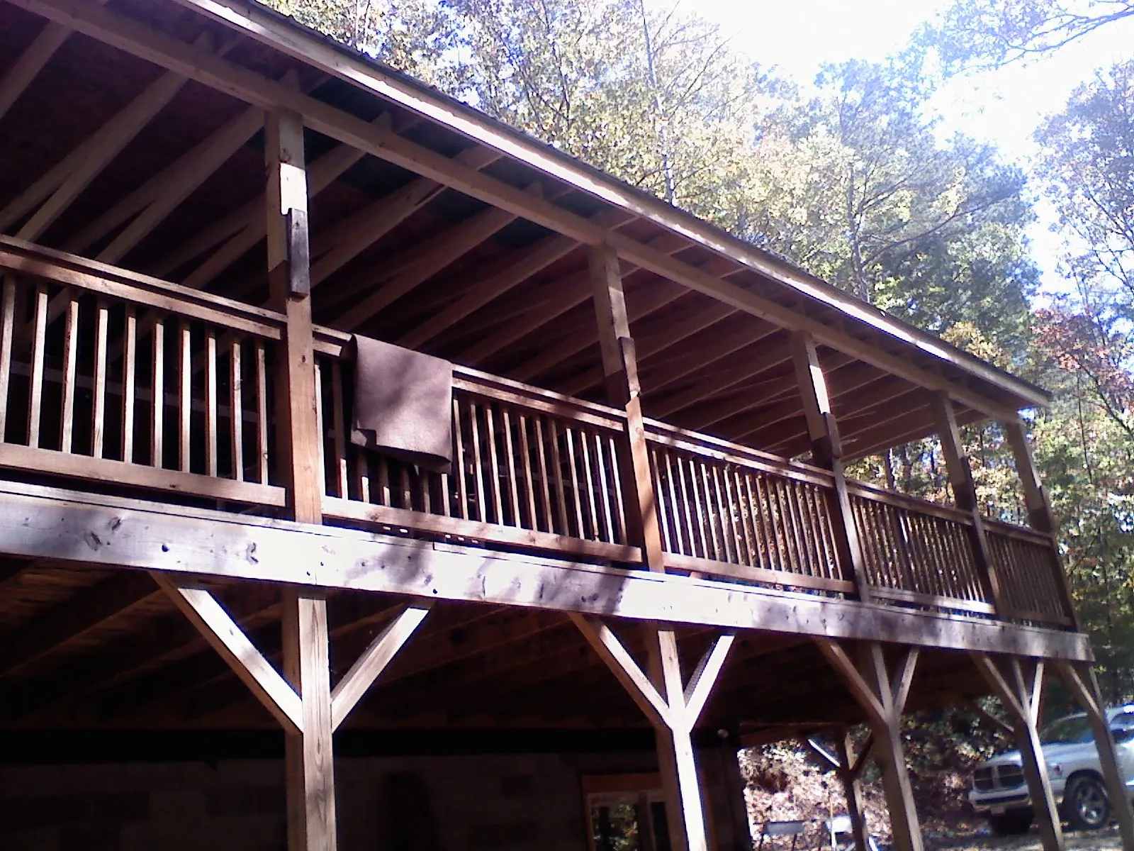 Timber framing under a new elevated porch and deck — Roof Leak Repair in Garland by Roofing Brothers